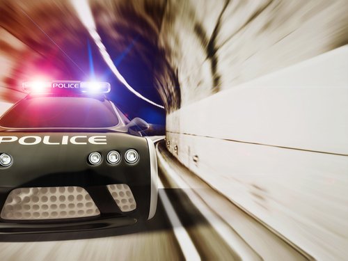 black police car with included flashing lights. First Responder Car Accident Attorney Help