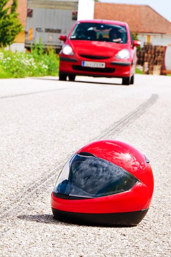 traffic accidents with skid marks on road. photo icon. Not Wearing a Motorcycle Helmet Can Mean Disaster in Court?