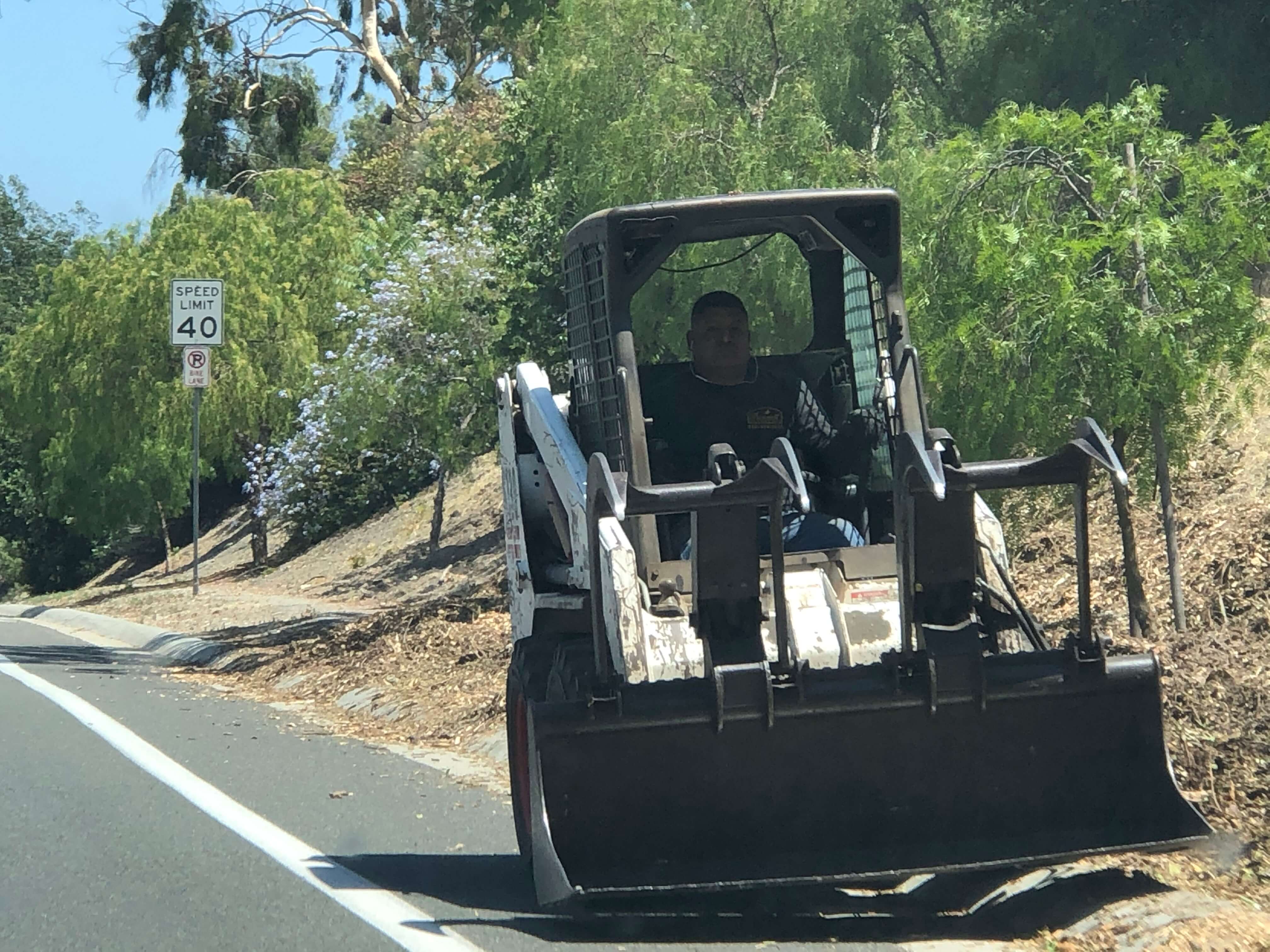 Bobcat earth mover during roadside work in Los Angeles, CA.