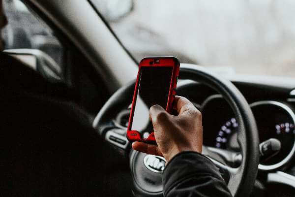 Distracted driver using a smartphone