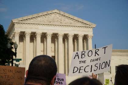 Roe v. Wade Pro abortion rights and pro life, anti infanticide demonstrators protest outside SCOTUS after the leak of a draft majority opinion written by Justice Samuel Alito readying for court majority to overturn landmark Roe v. Wade decision soon in Washington, May 3, 2022.