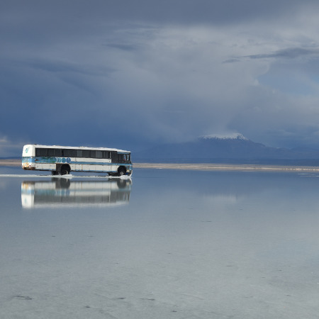 Bolivia bus traveling across the lake
